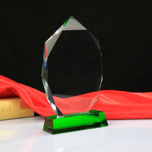 Bespoke Blank crystal awards on green stand for 3D laser engraving