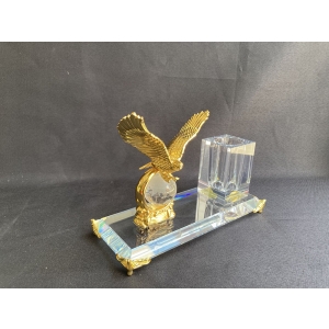 golden metal eagle figurines on glass globe pen holder